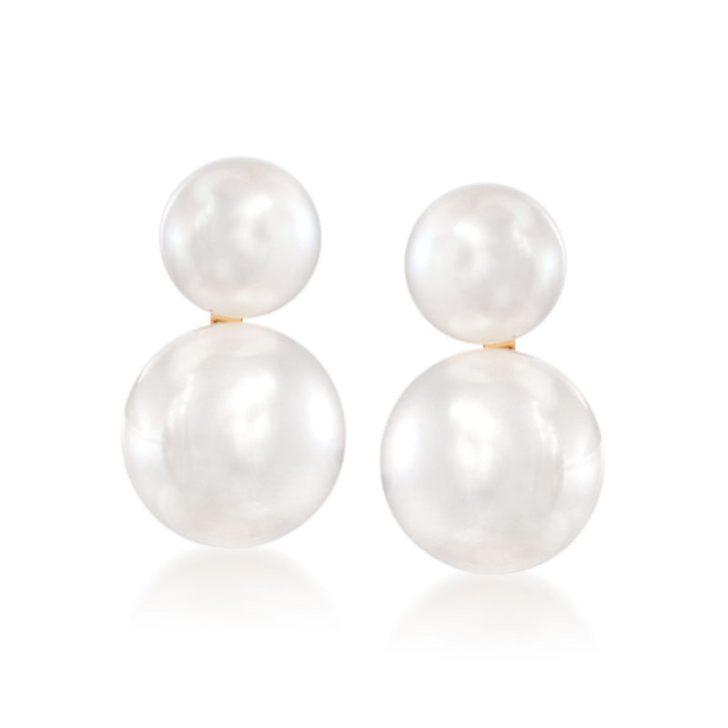 Double drop pearl earrings with round white pearls and gold top links, reflective finish