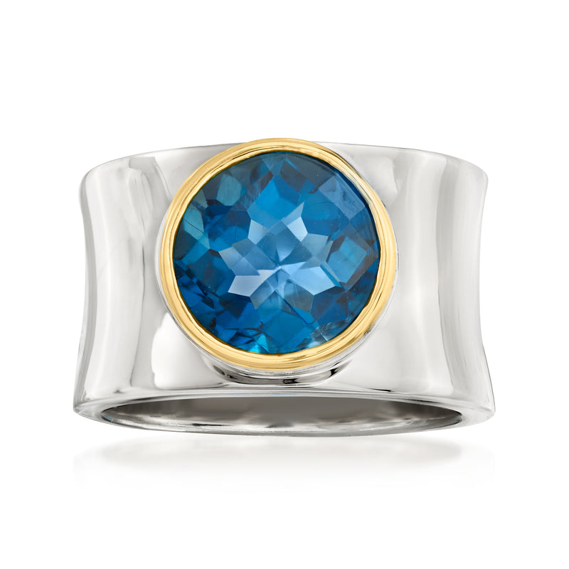 Curved sterling silver ring with blue topaz center and 14kt yellow gold bezel