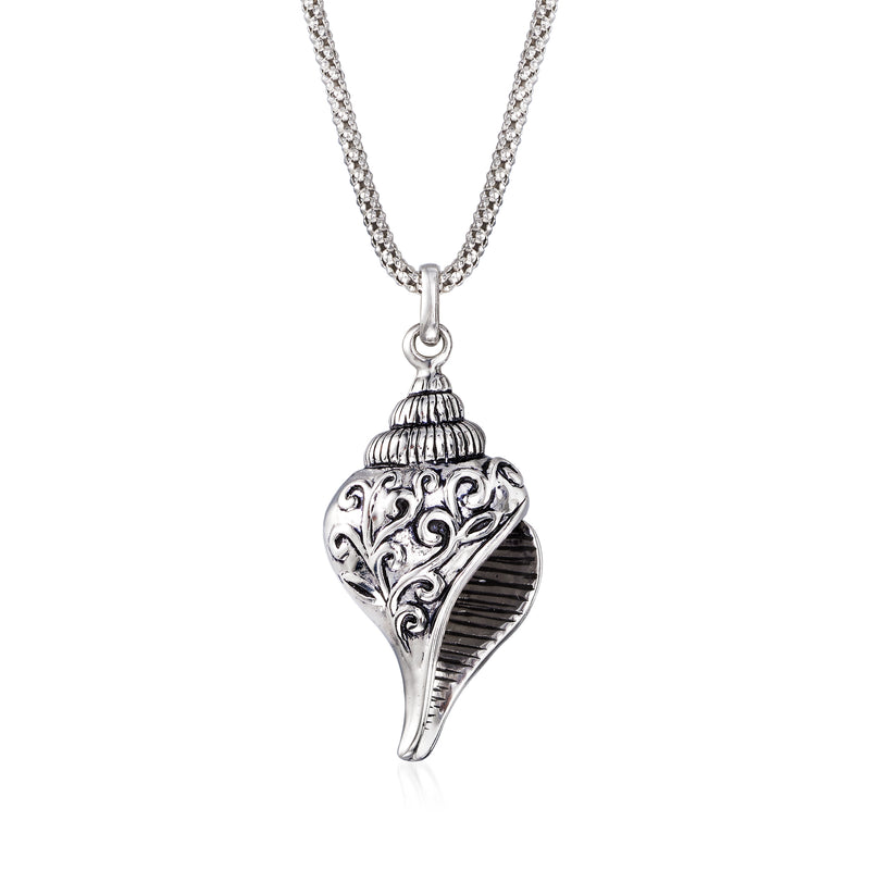 Silver seashell pendant necklace with scrollwork on a fine chain