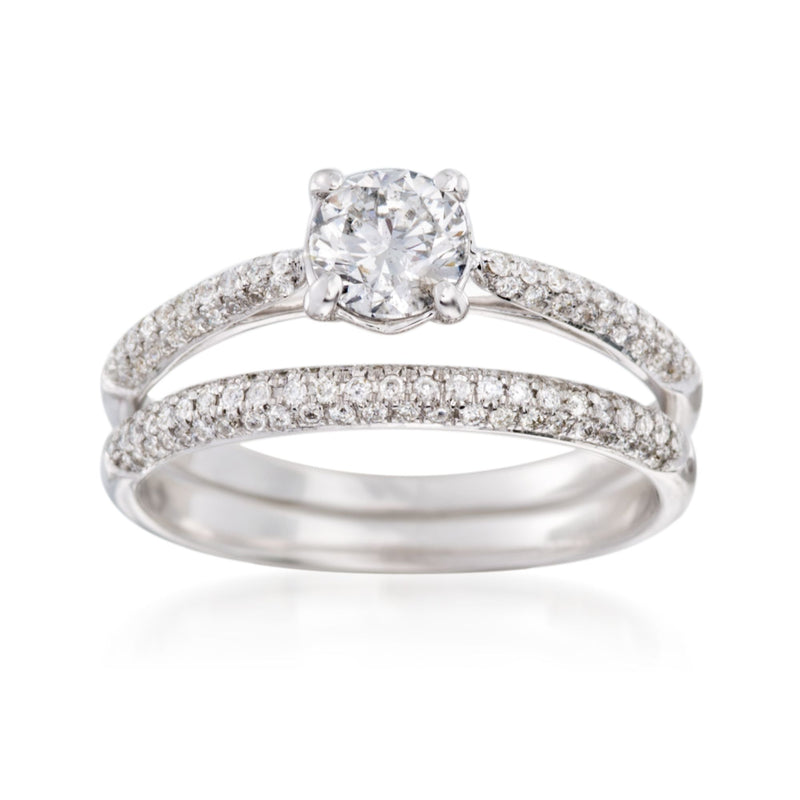 Diamond bridal set with round center stone and pavé bands in white gold