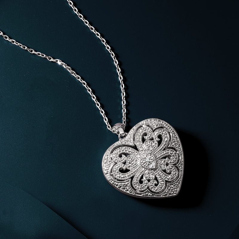 Sterling silver scrolled heart locket necklace with diamond-studded pendant