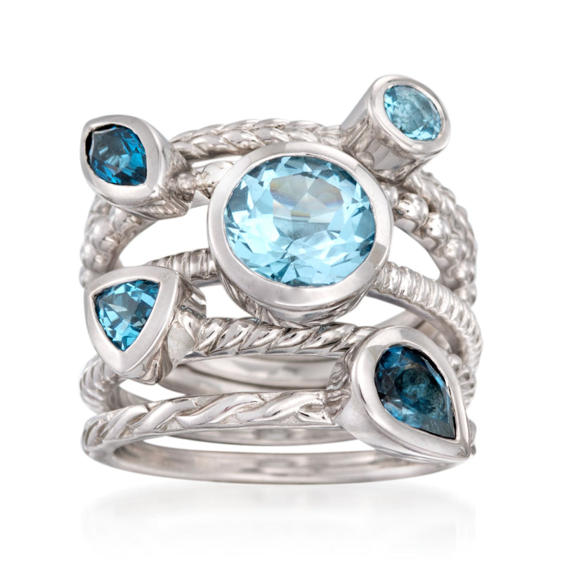 Sterling silver ring set with five oval blue topaz stones, tonal blue, twisted bands