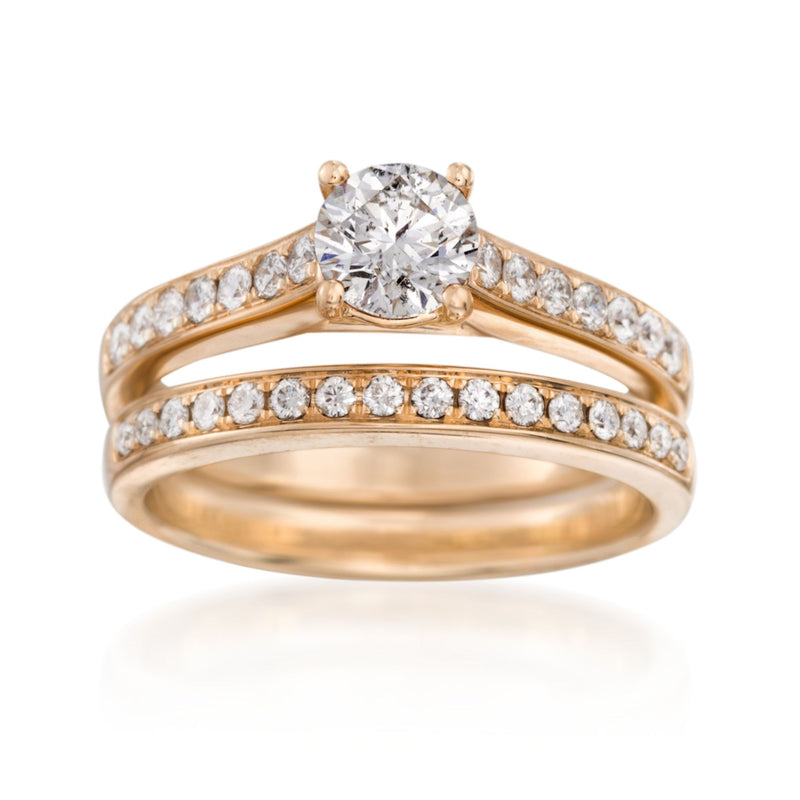 14kt yellow gold bridal set with round diamond engagement ring and wedding band