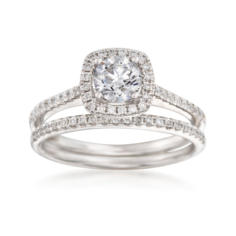 Diamond bridal set in 14kt white gold with round center stone and pave bands
