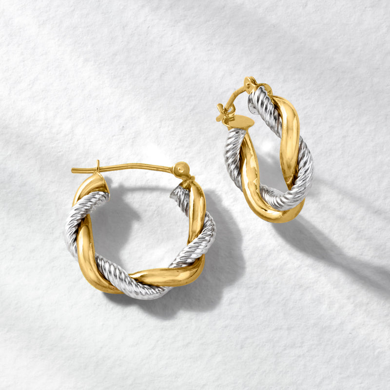 Two-tone twisted hoop earrings, yellow-gold outer and silver-tone inner twist