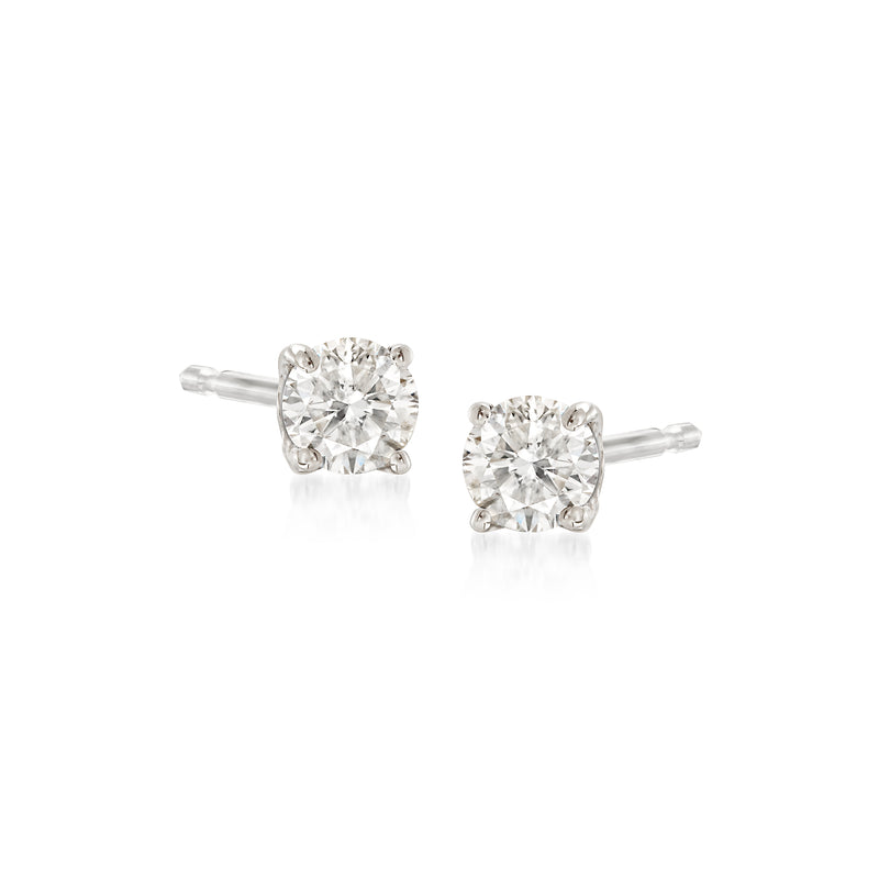 14kt white gold diamond stud earrings with round brilliant center stones, 0.15 ct total weight