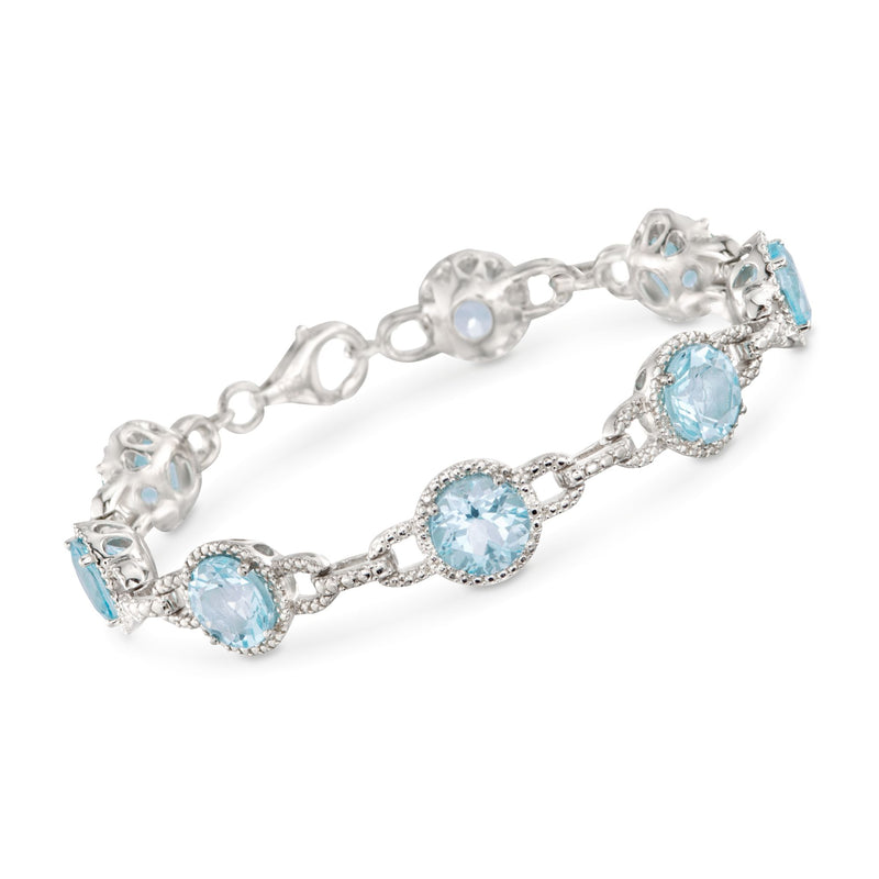 Sterling silver tennis bracelet with oval light-blue topaz stones and diamond accents