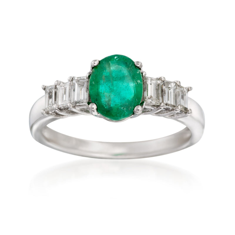 Emerald and diamond ring in 14kt white gold with oval emerald center and baguette sides