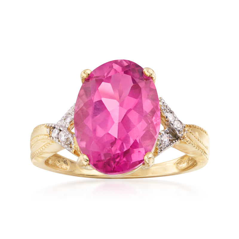14kt yellow gold ring with oval pink topaz center and diamond halo accents