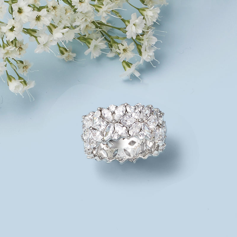 Sterling silver multi-shaped CZ eternity band with scalloped prong-set clear stones