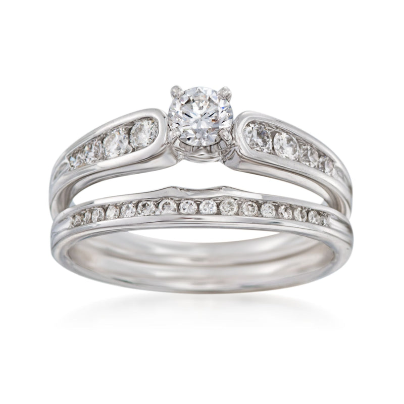 Diamond bridal set with round center stone and pavé bands in white gold