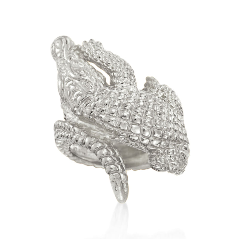 Sterling silver bypass ring with raised alligator-texture band and openwork detail