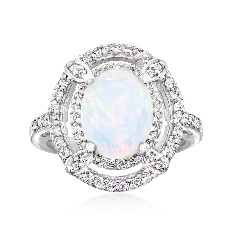 Sterling silver opal and white topaz oval ring with halo of round stones