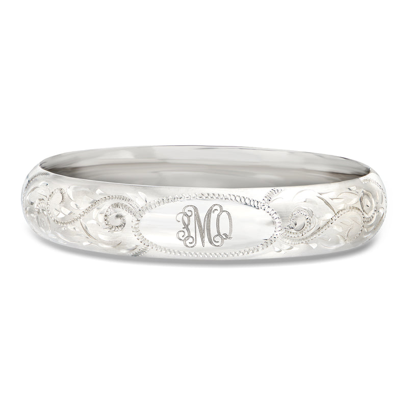 Sterling silver bangle bracelet with scrollwork and monogrammed center panel
