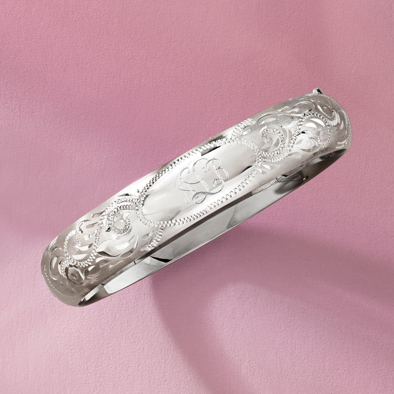 Sterling silver engraved scrollwork bangle bracelet, angled view with monogram detail