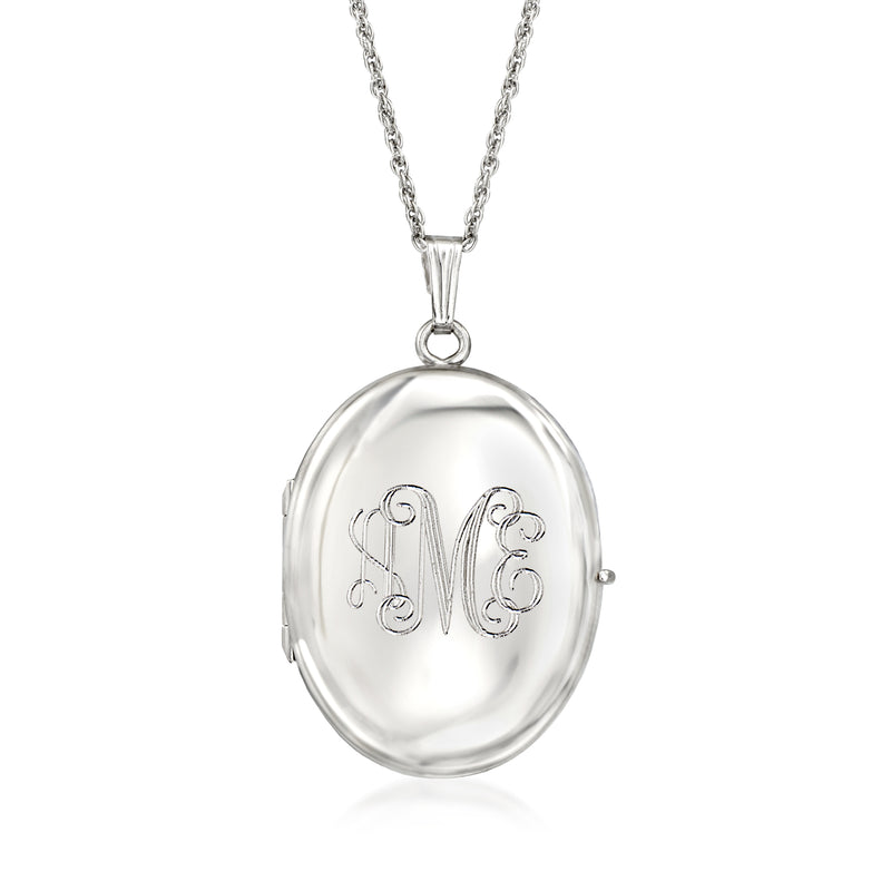 Silver oval locket necklace with chain and engraved scroll monogram detail