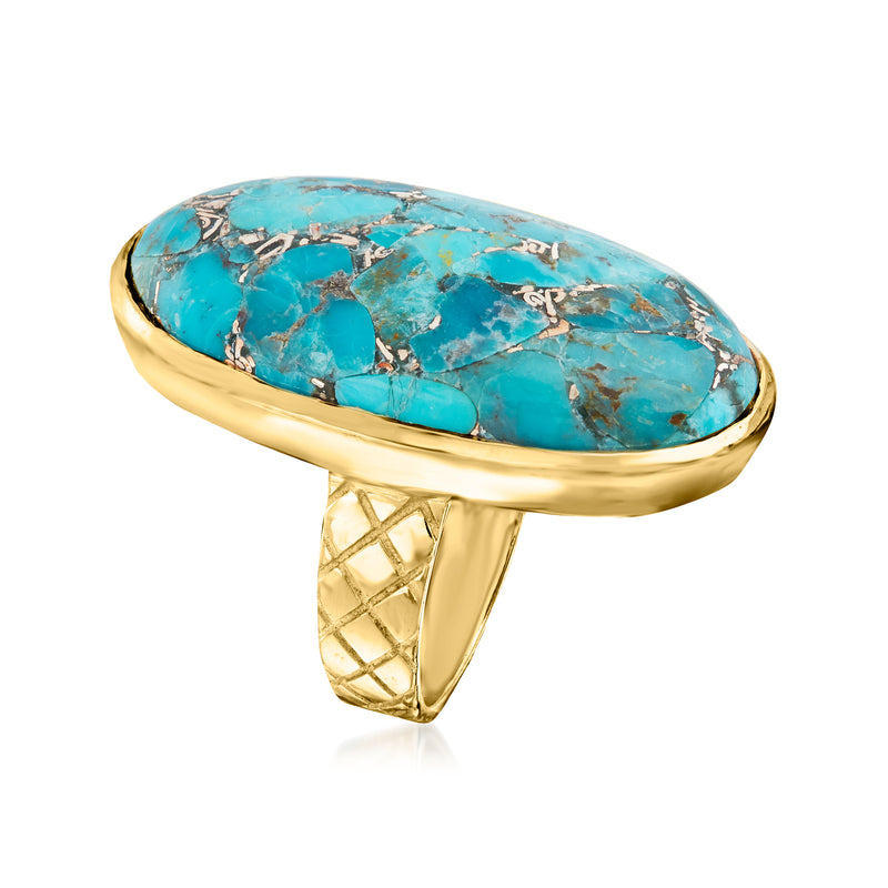 Oval turquoise ring in gold-toned setting, domed top and open crisscross band