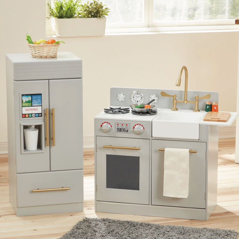 Gray modern kids play kitchen set with oven, stovetop, sink, and side cabinet.