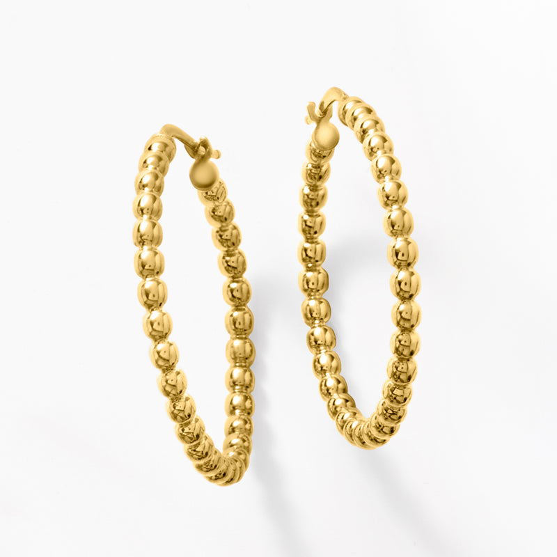 Textured gold beaded hoop earrings, side view with round bead pattern and post backs
