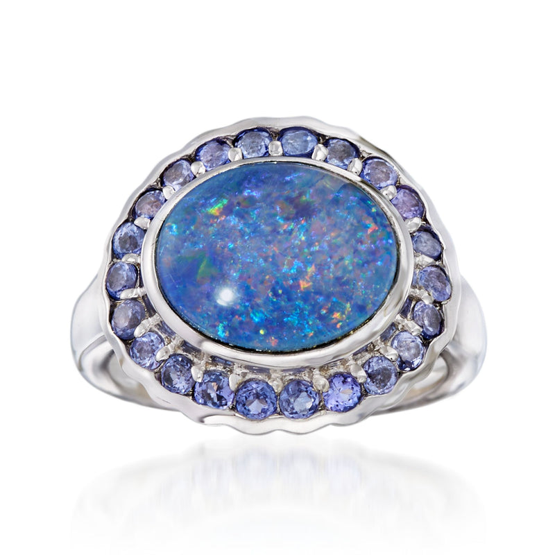 Sterling silver oval opal-style center ring with blue gemstone halo and side accents
