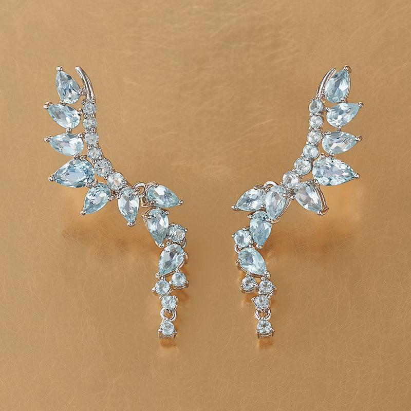 Sterling silver drop earrings with sky blue topaz marquise and round stones, curved design