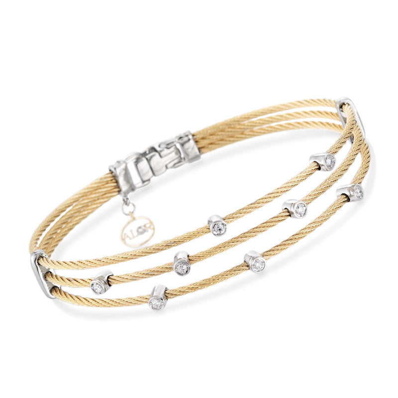 Two-tone gold cable bracelet with multiple round diamonds and clasp
