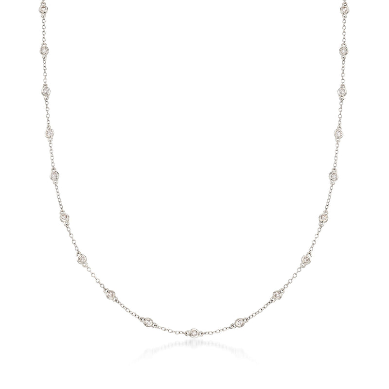 14kt white gold diamond station necklace with bezel-set round stones along chain