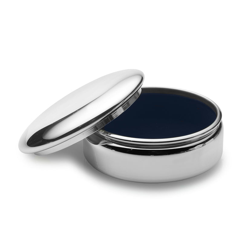 Large round pewter jewelry box with hinged lid, open to reveal dark interior