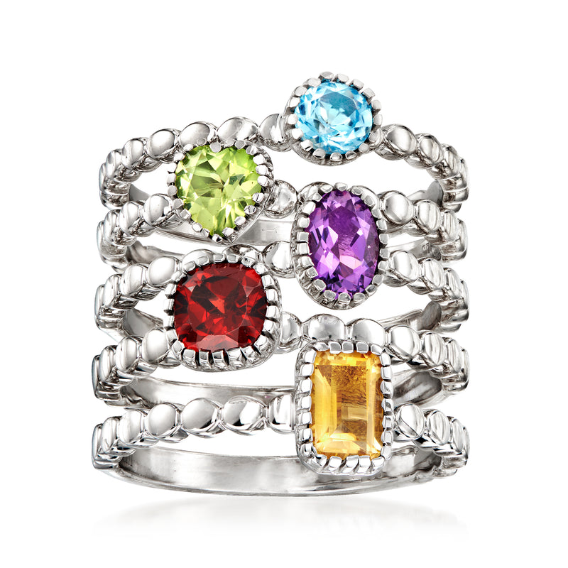 Five-ring sterling silver set with round blue, green, purple, red, and yellow gems.