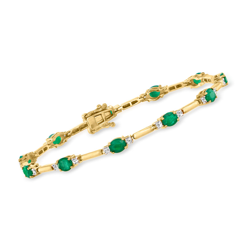 14kt yellow gold bracelet with green emerald and diamond station accents