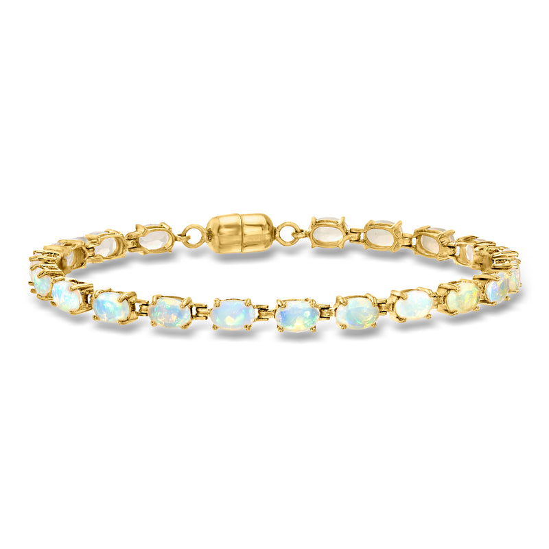 Gold tennis bracelet with oval opal-like gemstones and clasp detail