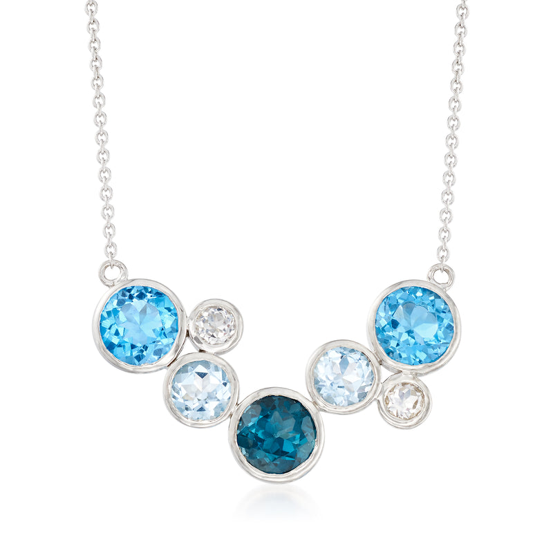 Sterling silver bezel necklace with round blue and white topaz stones on a chain
