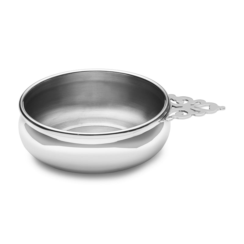Child's pewter porringer bowl with decorative side handle and wide rim