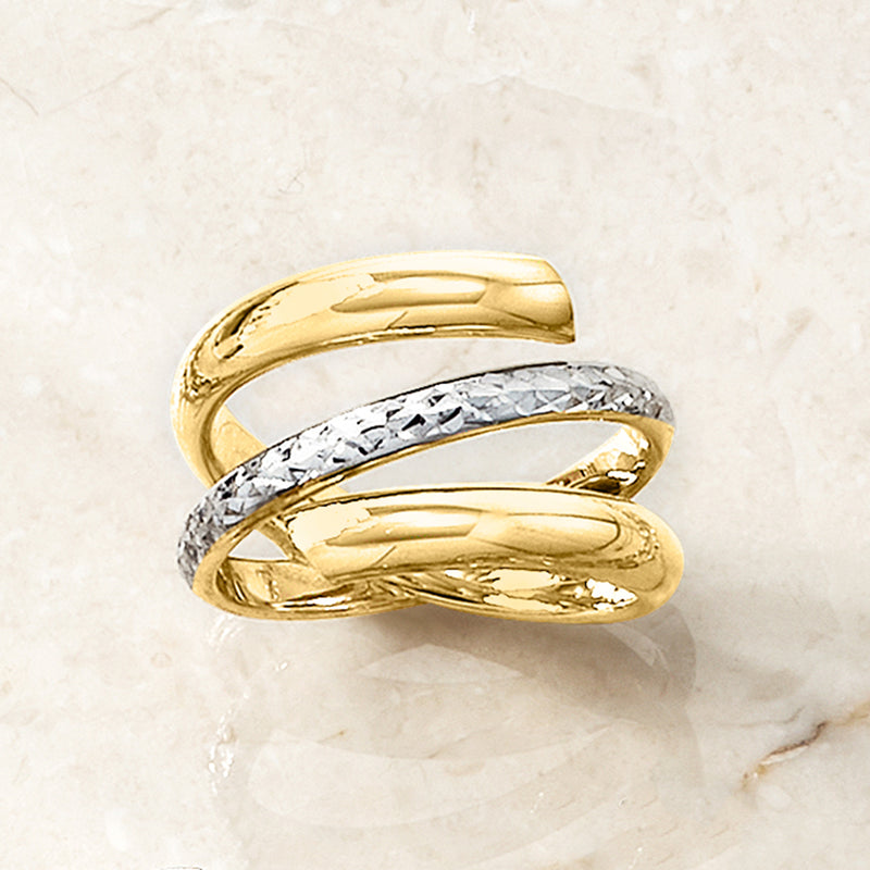 Two-tone spiral gold ring with textured silver center and glossy gold outer loops