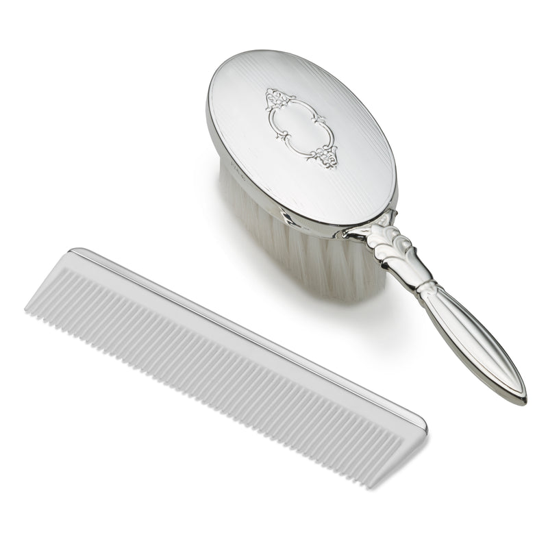 Sterling silver child’s oval brush with shield engraving and matching fine-tooth comb