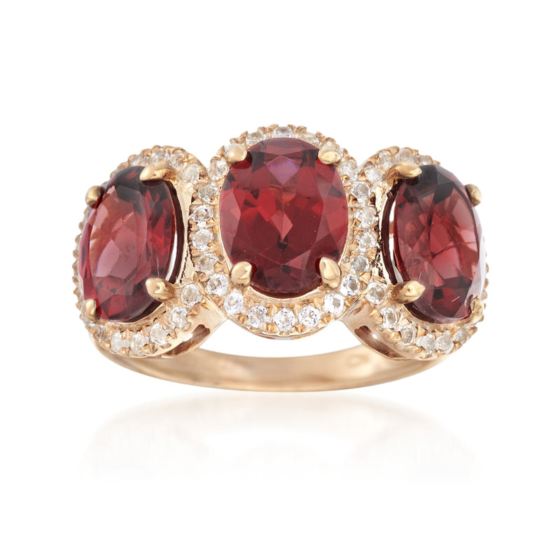 14kt gold over sterling ring with oval red garnet center and side stones, with white accents