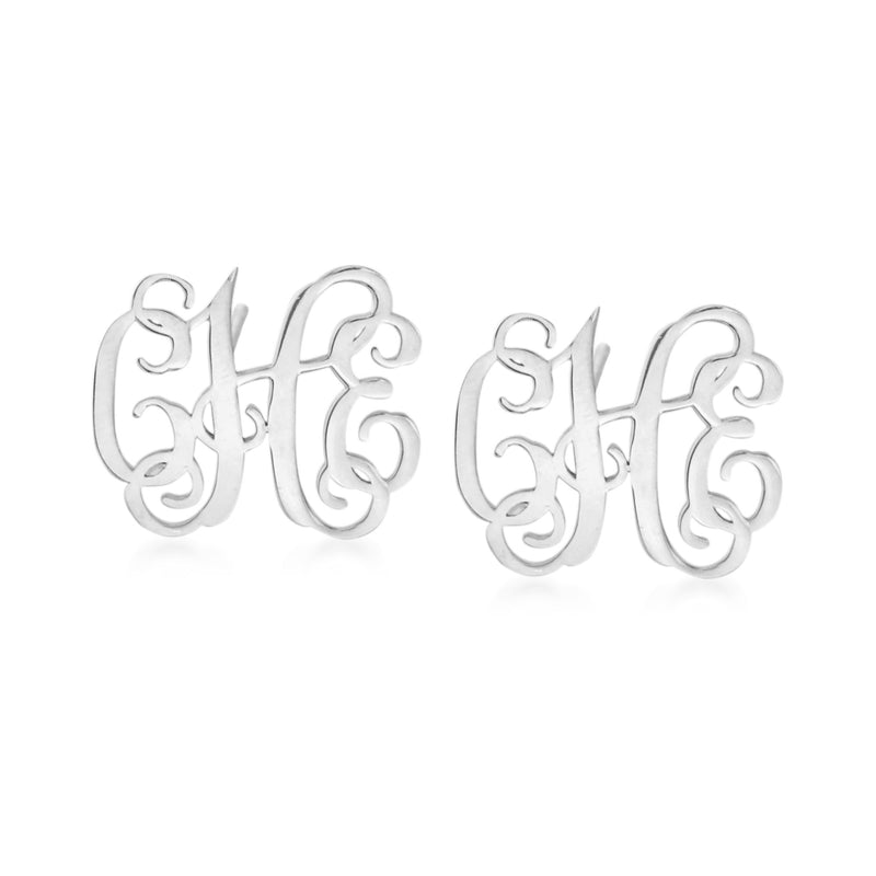 Sterling silver monogram stud earrings with raised cursive lettering on round posts