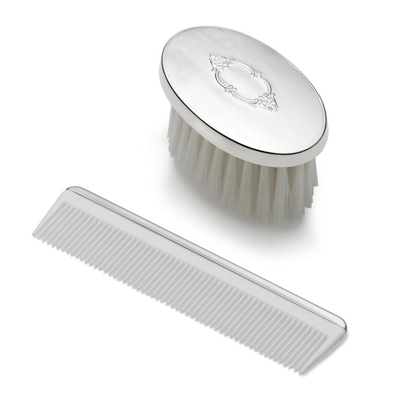 Children's sterling silver oval brush with crest and matching fine-tooth comb