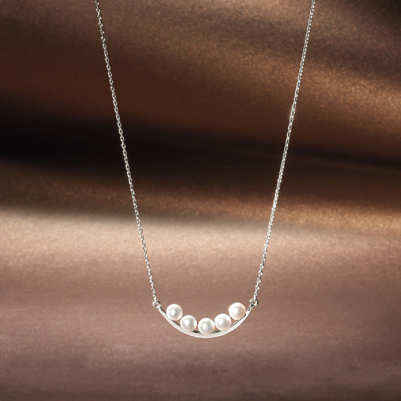 Curved bar pearl necklace on silver chain with small white cultured pearl cluster