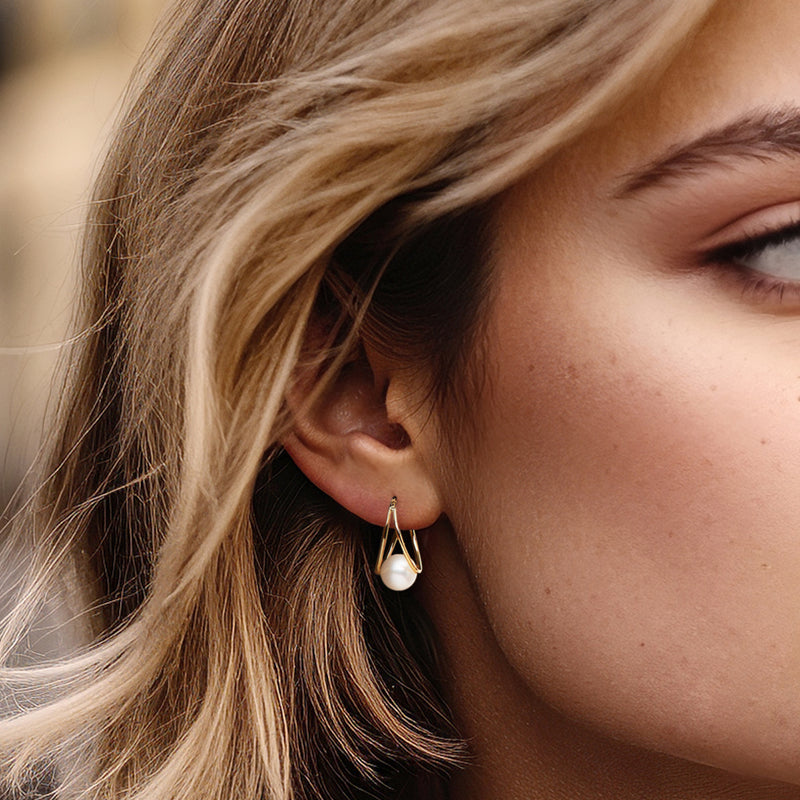 Cultured pearl double-hoop earrings in 14kt yellow gold on ear, 8–9mm pearls