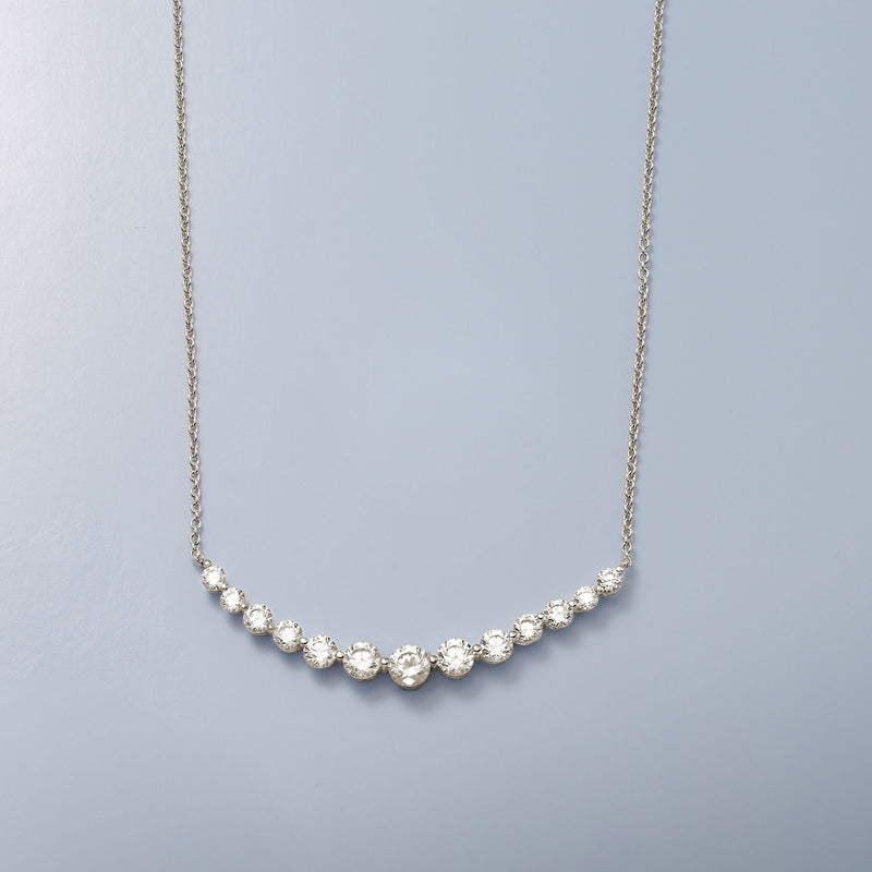 Silver-tone CZ curved bar necklace with oval stones on a fine chain