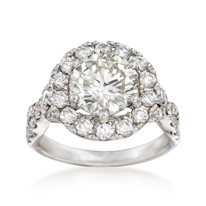 14kt white gold diamond halo ring with round center stone and pave band
