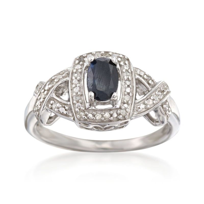 Sterling silver ring with oval blue sapphire center and diamond halo