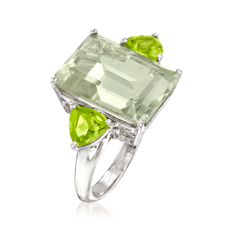 Sterling silver ring viewed from side, emerald-cut light green center with peridot side stones