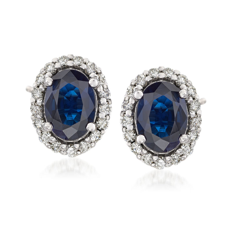 Oval blue sapphire frame stud earrings with diamond halo in 14kt white gold