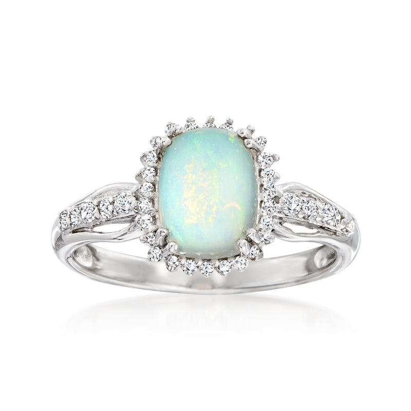 Sterling silver oval opal halo ring with white stone accents