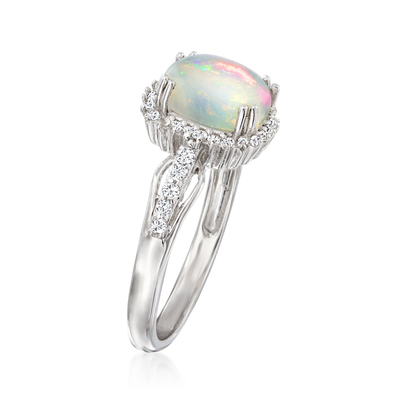Sterling silver oval opal ring with white stone halo and prong setting