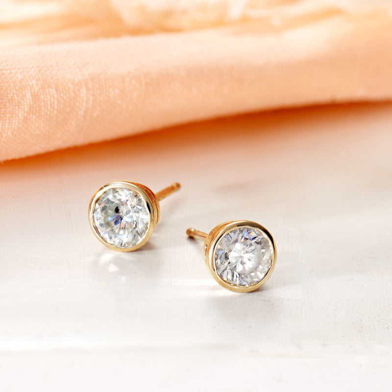 Round diamond stud earrings, 14kt yellow gold bezel settings