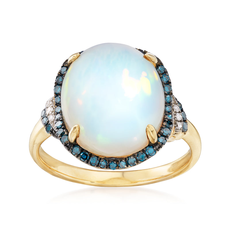 Oval opal center ring with blue gemstone halo and diamond-like accents, yellow gold band