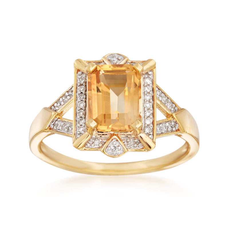 Gold citrine diamond ring with emerald-cut center, diamond halo and side accents